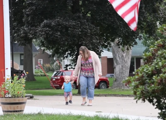 woman and child walking together